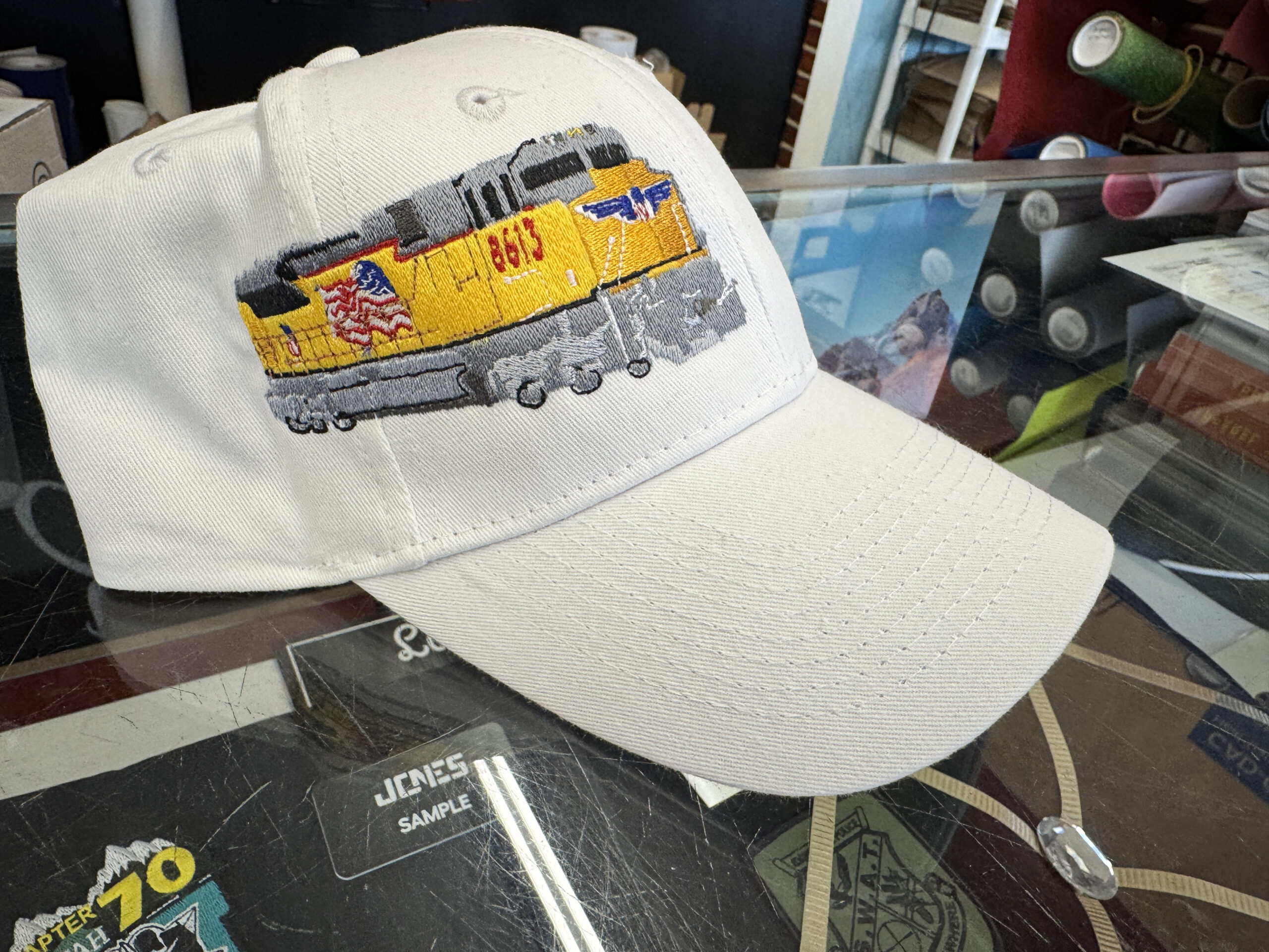 Embroidered cap with train embroidery