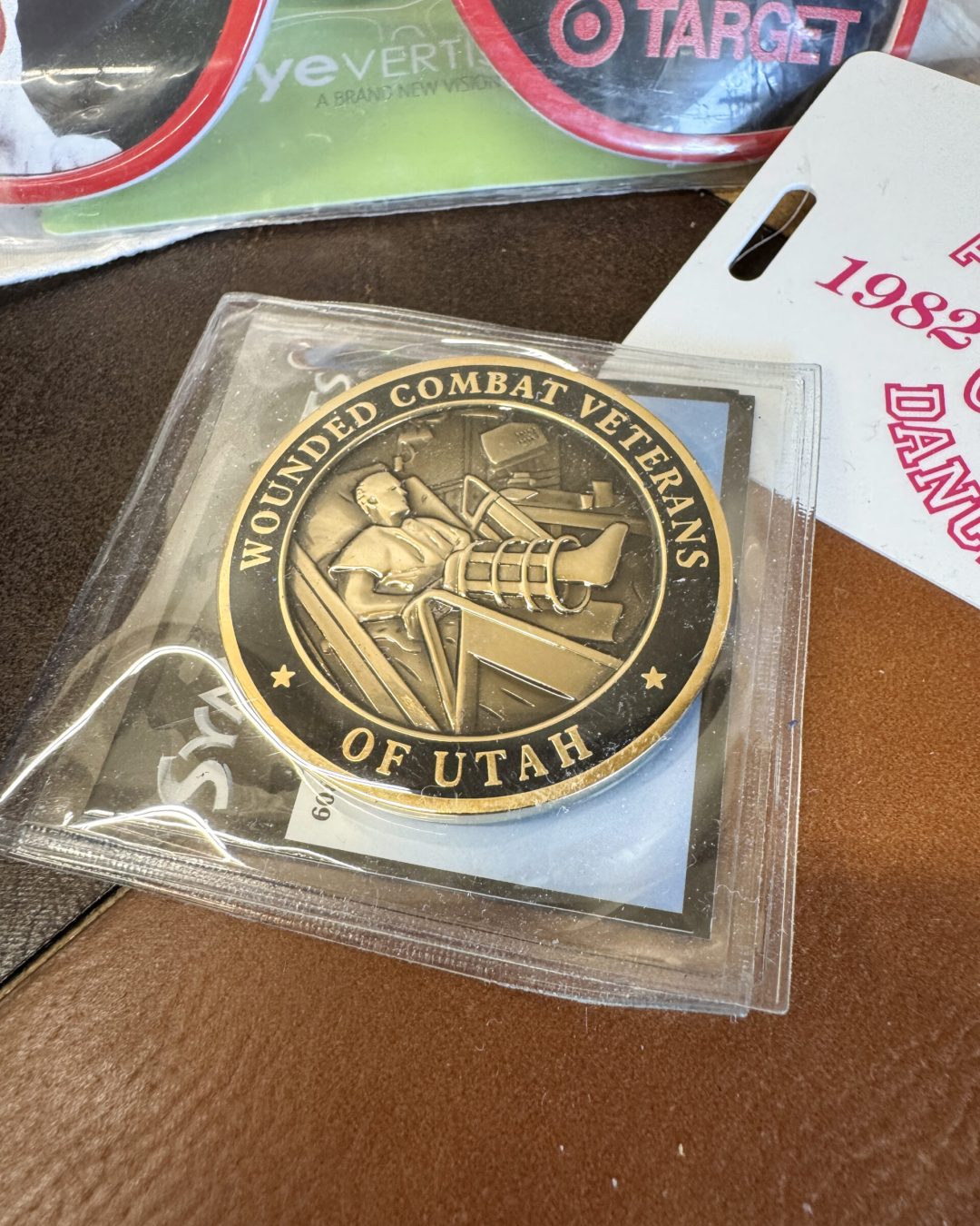 Custom Wounded Combat Veterans of Utah challenge coin and branded promotional materials