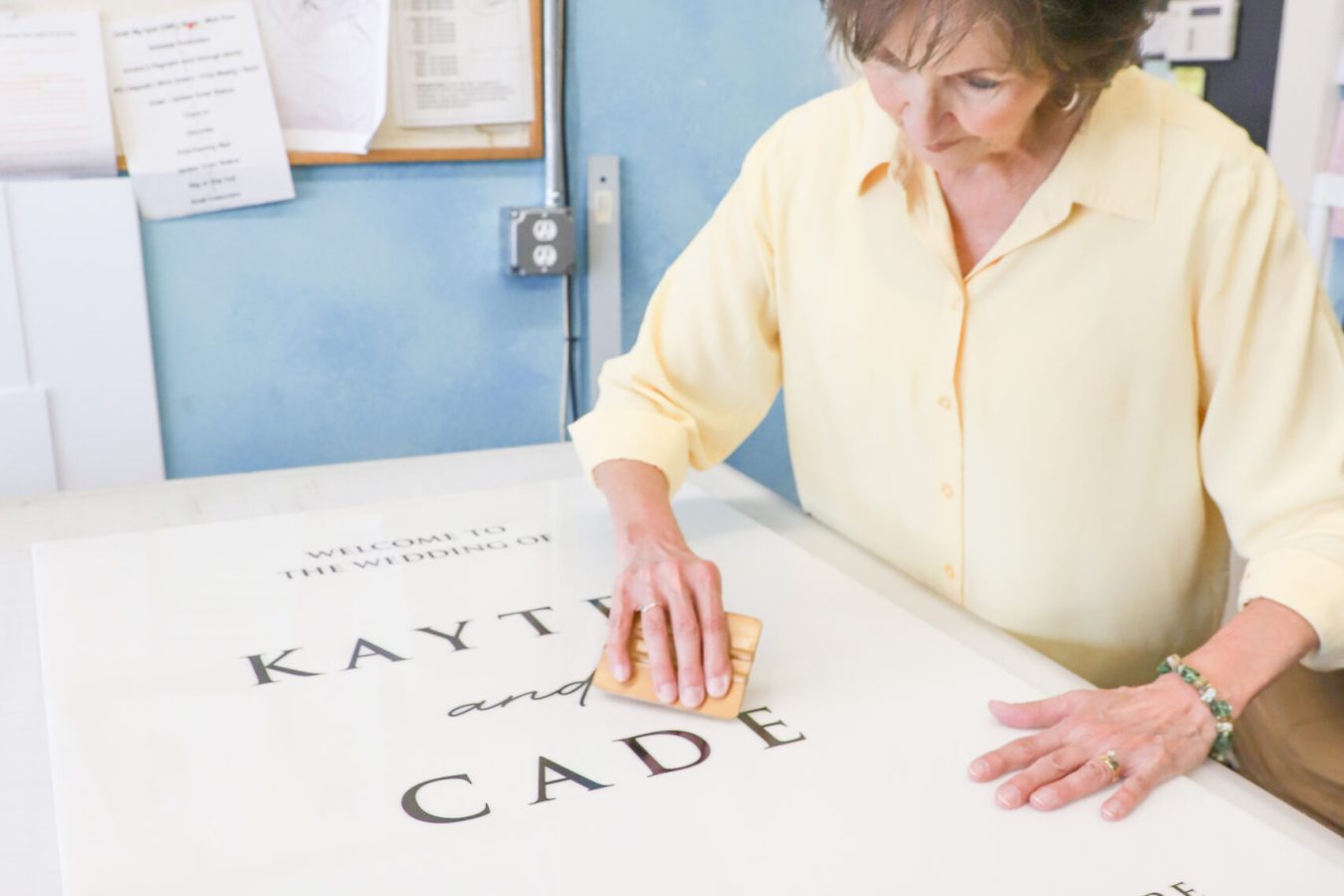 Jones team member preparing a large custom banner